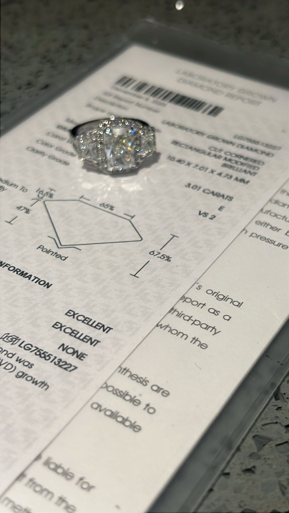 Customer diamond ring displayed with its independent grading report