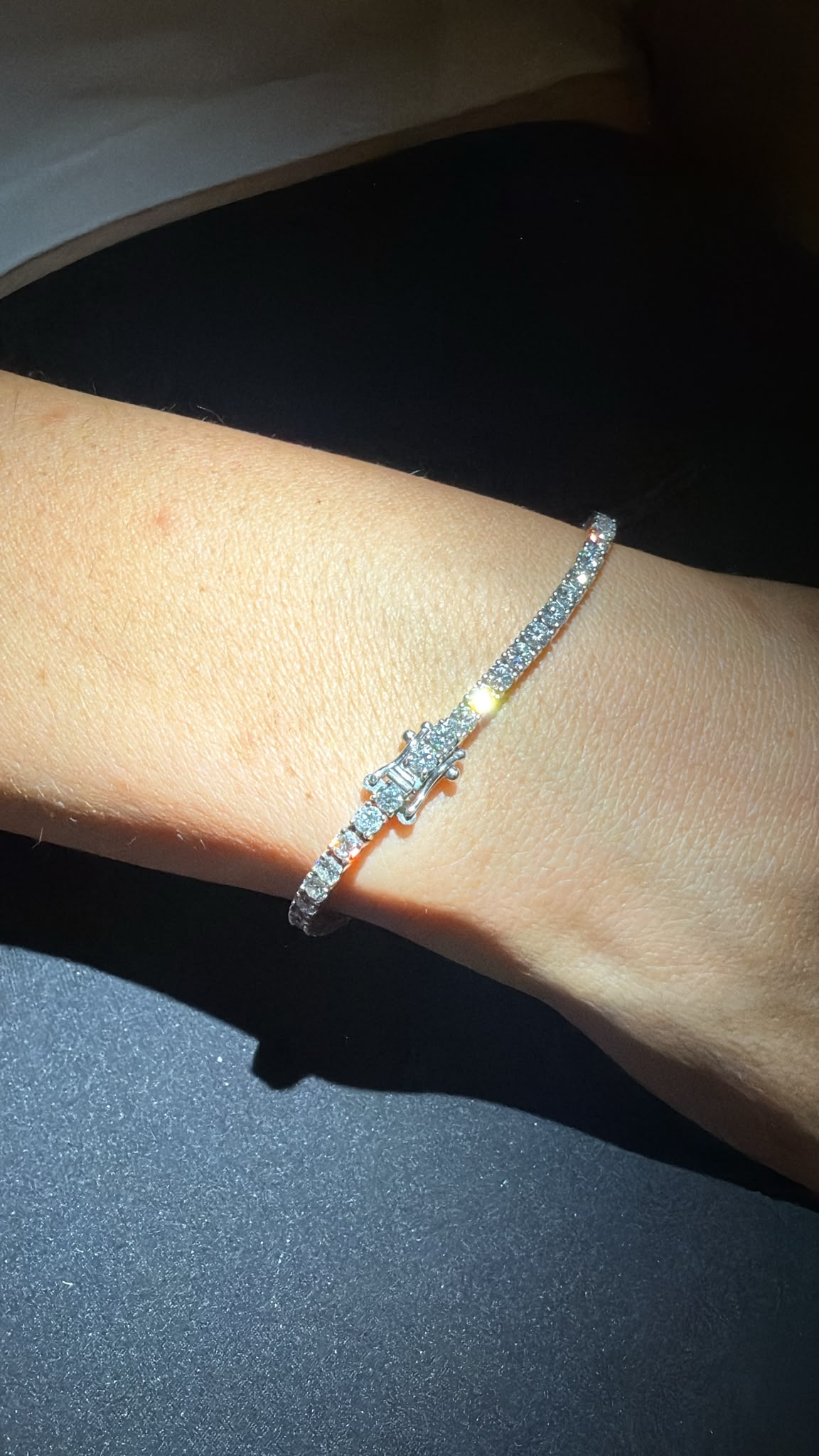 Laboratory-grown diamond tennis bracelet worn on wrist